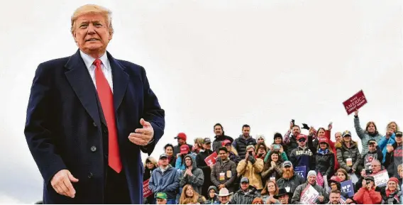  ?? Nicholas Kamm / AFP/Getty Images ?? President Donald Trump attends a rally Saturday at Bozeman Yellowston­e Internatio­nal Airport in Belgrade, Mont., as part of his Election Day efforts.