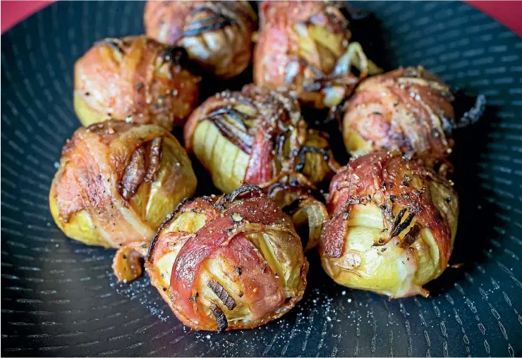  ?? MAARTEN HOLL/STUFF ?? You will want to make extra of the bacon-wrapped new potatoes - they disappear very fast.