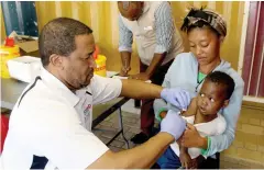  ??  ?? DEDICATED: Western Cape Government health staff under police protection again proved their commitment to the health of children by returning to Avian Park, Worcester, to complete a vaccinatio­n campaign.
