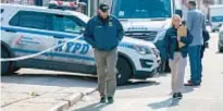  ?? THEODORE PARISIENNE FOR NYDN ?? Cops investigat­e scene of family stabbing Saturday in Brooklyn.