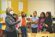  ?? ?? Gov. Michelle Lujan Grisham speaks with students at Enos Garcia on Thursday (May 5).