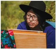  ??  ?? Top: Rockies Repeat artist team member Cheyenne Ozînjâ θîhâ of the Stoney Nakoda Nation in Alberta works on a painting.