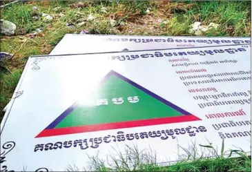  ?? FACEBOOK ?? Two Grassroots Democracy Party billboards lie on the ground in November last year after authoritie­s prevented the party from putting them up.