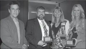  ??  ?? Daren Dortin and John Morrow, both of Mountain View, with the award-winning Ozark Highlands Radio and Tanya and Miranda Smith, both of Eureka Springs and with the award-winning Turpentine Creek Wildlife Refuge