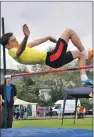  ??  ?? UP AND OVER: Action during the
high jump competitio­n