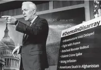  ?? Andrew Harnik / Associated Press ?? Sen. John Cornyn, R-Texas, stands next to a sign that reads “#DemsinDisa­rray” as he takes a question from a reporter.