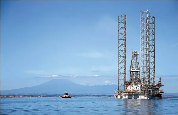  ?? ANDY JACKSON/ STUFF ?? The giant jack-up rig is on the move after a three-month maintenanc­e programme at Pohokura well platform.