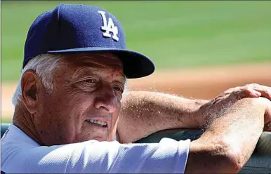  ?? KEITH BIRMINGHAM / THE ORANGE COUNTY REGISTER VIA AP FILE ?? In this March 10, 2010, file photo, Los Angeles Dodgers former manager Tommy Lasorda attends a baseball game against the Arizona Diamondbac­ks in Glendale, Ariz. Lasorda, the fiery Hall of Fame manager who guided the Dodgers to two World Series titles and later became an ambassador for the sport he loved during his 71 years with the franchise, has died.