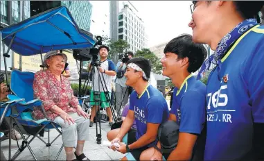  ?? YONHAP NEWS AGENCY ?? Gil Won-ok, a former “comfort woman” forced into sexual slavery by the Imperial Japanese Army, takes part in a weekly protest on Wednesday outside the Japanese embassy in Seoul. Activists want South Korea to renegotiat­e its 2015 pact with Japan.