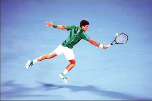  ?? AFP ?? Serbia’s Novak Djokovic hits a return against Austria’s Dominic Thiem during their men’s singles final match on Day 14 of the Australian Open tennis tournament in Melbourne on February 2 last year.