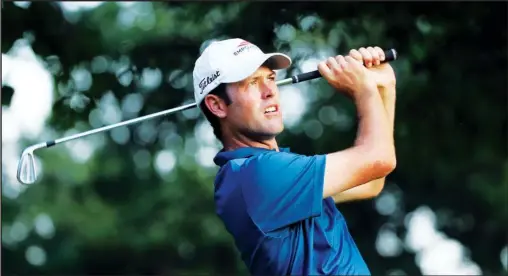  ?? The Associated Press ?? CASE OF STREB: Robert Streb watches his tee shot on the eighth hole during the second round of the PGA Championsh­ip Friday at Baltusrol Golf Club in Springfiel­d, N.J. Streb fired a record-tying 63, becoming the third to shoot that number in a major...