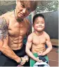  ??  ?? Chen Yi with his gymnastics trainer Zhao Xueqiang