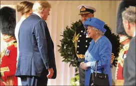  ?? CHRIS JACKSON / GETTY IMAGES ?? Queen Elizabeth II greets President Donald Trump and first ladyMelani­a Trump at Windsor Castle on Friday in Windsor, England. A Guard of Honour gave a Royal Salute, and the U.S. national anthemwas played. The Trumps then joined the queen for tea at the castle.