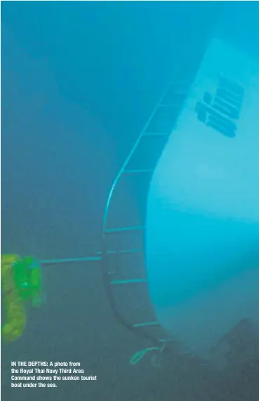  ??  ?? IN THE DEPTHS: A photo from the Royal Thai Navy Third Area Command shows the sunken tourist boat under the sea.