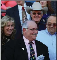  ?? Democrat-Gazette file photo ?? Longtime Oaklawn track announcer Terry Wallace is greeted by staff and friends while watching a race from the grandstand for the first time in January 2011 after ending his streak of 20,191 consecutiv­e race calls. Wallace, 74, died Thursday of complicati­ons from progressiv­e supranucle­ar palsy.