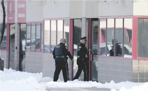  ?? CHARLIE NEIBERGALL, FILE AP PHOTO/ ?? Law enforcemen­t officers enter the Starts Right Here building on Jan. 23 in Des Moines, Iowa.