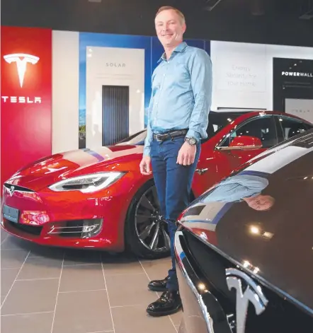  ?? Picture: AAP ?? Ben Scully in the new Tesla showroom, in Fortitude Valley, Brisbane.