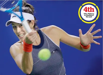  ?? AP ?? Garbine Muguruza returns a shot to Monica Puig during their second round match of the Pan Pacific Open in Tokyo, on Wednesday. —