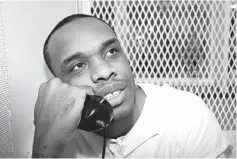  ?? Associated Press ?? ■ Death-row inmate Christophe­r Young holds a phone to his ear June 13 during an interview outside death row at the Texas Department of Criminal Justice Polunsky Unit near Livingston, Texas. The Texas Court of Criminal Appeals refused to stop the...