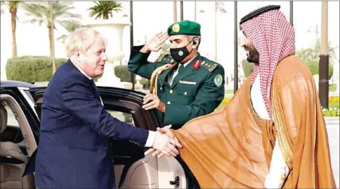  ?? AFP ?? British Prime Minister Boris Johnson (left) is welcomed by Saudi Arabia’s Crown Prince Mohammed bin Salman during a one-day visit to Saudi Arabia and the UAE on Wednesday.