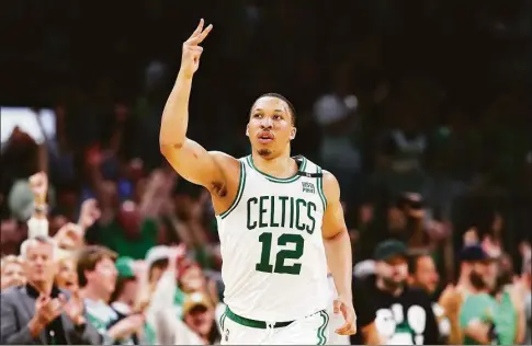  ?? Adam Glanzman / Getty Images ?? The Celtics’ Grant Williams reacts after making a 3-point basket during the third quarter against the Bucks in Game 7 of the Eastern Conference semifinals Sunday in Boston.