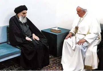  ?? VATICAN MEDIA ?? Pope Francis, right, meets Saturday with Iraq’s leading Shiite cleric, Grand Ayatollah Ali al-Sistani, in Najaf, Iraq. Their meeting at al-Sistani’s home was the first between a pope and a grand ayatollah.