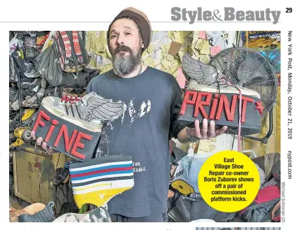  ??  ?? East Village Shoe Repair co-owner Boris Zuborev shows off a pair of commission­ed platform kicks.