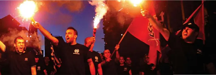  ?? Pictures: JAMIE WISEMAN / GETTY ?? Hatred: The Far-Right Golden Dawn party uses fascist symbols