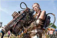  ??  ?? A dressed- up youth poses during the Wacken Open Air summer open- air heavy metal music festival on Thursday.