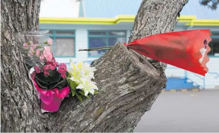  ??  ?? Floral tributes were left after Aldrich Viju, aged 4, was killed in a playground accident at Angels Childcare Centre in Auckland in 2016.