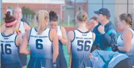  ??  ?? Geelong women’s coach Shane Walters talks to his players at half-time.