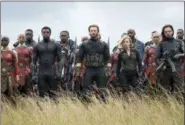  ?? THE ASSOCIATED PRESS ?? This image released by Marvel Studios shows, front row from left, Danai Gurira, Chadwick Boseman, Chris Evans, Scarlet Johansson and Sebastian Stan in a scene from “Avengers: Infinity War.”