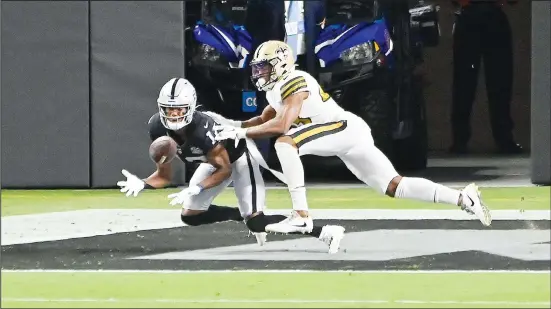  ??  ?? Las Vegas Raiders wide receiver Zay Jones (left), catches a touchdown against New Orleans Saints free safety Marcus Williams (43) during the first half of an NFL football game on Sept 21,
in Las Vegas. (AP)