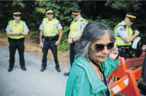  ?? THE CANADIAN PRESS/BEN NELMS ?? Protester Tsastilqua­lus speaks to media after being arrested during the removal of Camp Cloud on Thursday.