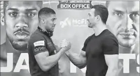  ??  ?? Anthony Joshua en Vladimir Klitsjko. (Foto: De Telegraaf)