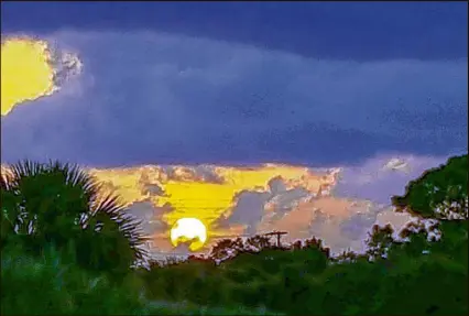  ?? TOM PEELING / THE PALM BEACH POST ?? The sun rises over the Hypoluxo Scrub Natural Area in Hypoluxo on Friday. Saharan dust, often carried across the Atlantic Ocean on easterly summer breezes, has drifted over the Sunshine State in the largest plume so far this season, giving sunrises a...