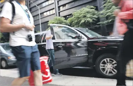  ?? Spencer Platt Getty Images ?? UBER BOARD MEMBERS and executives are launching a search for a new chief who they view as having a broad canvas to craft a fresh narrative and inspire an improved culture. Above, a man enters an Uber SUV in New York last week.