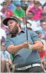  ??  ?? Andrew Johnston watches his shot from the first tee during the third round.