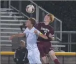  ?? PETE BANNAN — DIGITAL FIRST MEDIA ?? Unionville’s Thomas Kelly (4) and Henderson’s Sam Martin look to control the ball Monday evening as the Warriors defeated Unionville 1-0 on a goal by Kevin Kiefer.