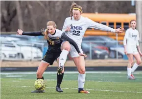  ??  ?? Kettle Moraine senior Tessa Lux (22) battles Germantown's Megan French during a game in March. SCOTT ASH / NOW NEWS GROUP