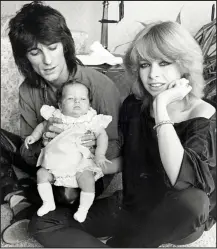  ??  ?? Above: Ronnie Wood with second wife Jo and baby Leah in 1979