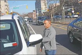  ?? AP/SETH WENIG ?? Livery cab driver Antonio Rosario gets into his car last week in the Bronx borough of New York.