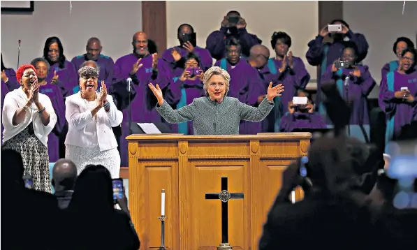  ??  ?? Hillary Clinton addresses the Union Baptist Church in Durham, North Carolina. Her team is quietly confident of a landslide victory in the presidenti­al election and has diverted resources to senatorial and governor contests