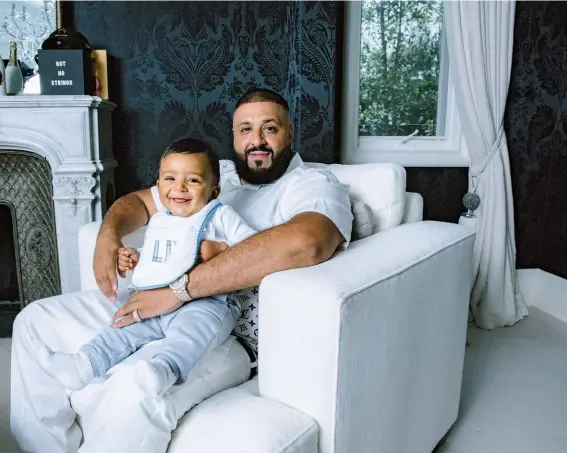 ??  ?? Khaled with his 8-month-old Asahd, his son with Tuck. Asahd has an executive producer credit on Khaled’s new album, Grateful.