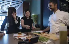  ??  ?? Sharing a light moment with stylist Yong Woei Na and chef Rishi Naleedra of CHEEK BISTRO during our cover shoot.