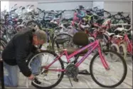  ?? CHARLES PRITCHARD - ONEIDA DAILY DISPATCH ?? Community Bikes Founder and Chair Chuck Fox works on a bike for the upcoming ninth annual Bike Day on Wednesday, May 1, 2019.