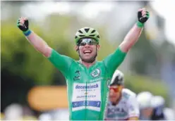  ?? Agence France-presse ?? ↑
Mark Cavendish celebrates as he crosses the finish line of the 6th stage at the Tour de France on Thursday.