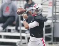  ?? JAY LAPRETE — THE ASSOCIATED PRESS ?? Ohio State quarterbac­k Justin Fields throws a pass Oct. 3 during practice in Columbus.