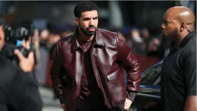  ?? JOE SCARNICI/GETTY IMAGES ?? Drake has so far not responded to requests that he encourage witnesses of his friend’s killing to step forward. The rapper has subsequent­ly been subjected to a form of trial-by-media often used against the Black community, Vicky Mochama writes.