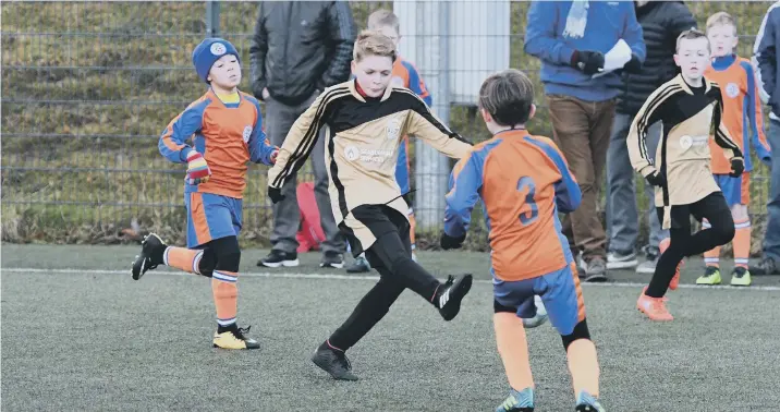  ??  ?? Russell Foster action at East Durham College, Peterlee, with Dalton Park Rangers U10s (orange) taking on Wearmouth Wolves U10s (gold).